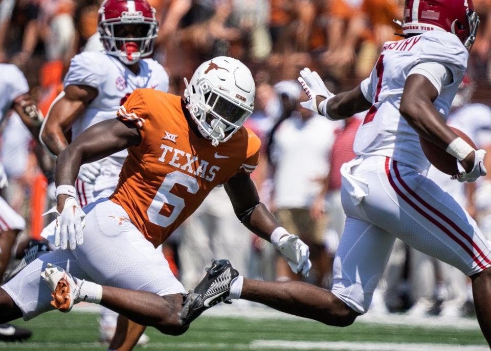 Texas cornerback Ryan Watts closes in on Alabama's Kool-Aid McKinstry during last year's game at Royal-Memorial Stadium. Watts, who had transferred in from Ohio State, was making his second start as a Longhorn that day.