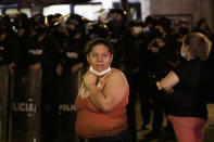 Relatives of inmates wait for news outside the Litoral penitentiary after a riot, in Guayaquil, Ecuador, Tuesday, Sept. 28, 2021. A police and military operation managed to regain control of the regional prison after five hours, according to a statement from Ecuador’s prison service, but reported at least 24 dead and 48 injured during the riot. (AP Photo/Angel DeJesus)