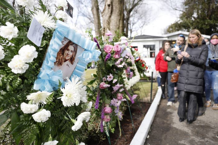 Lisa Marie's framed photo appears amid floral tributes