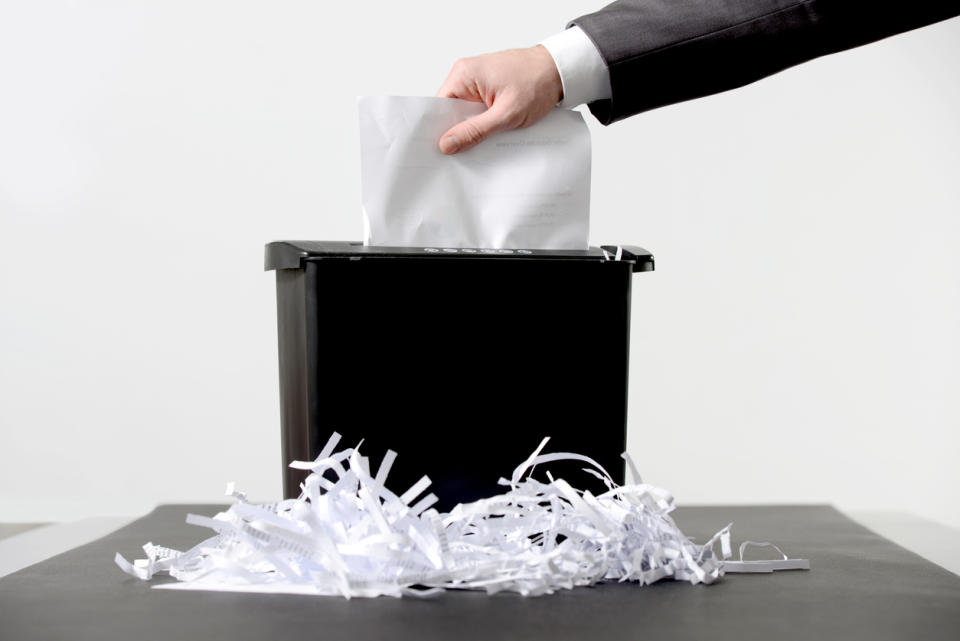 A shredding a paper