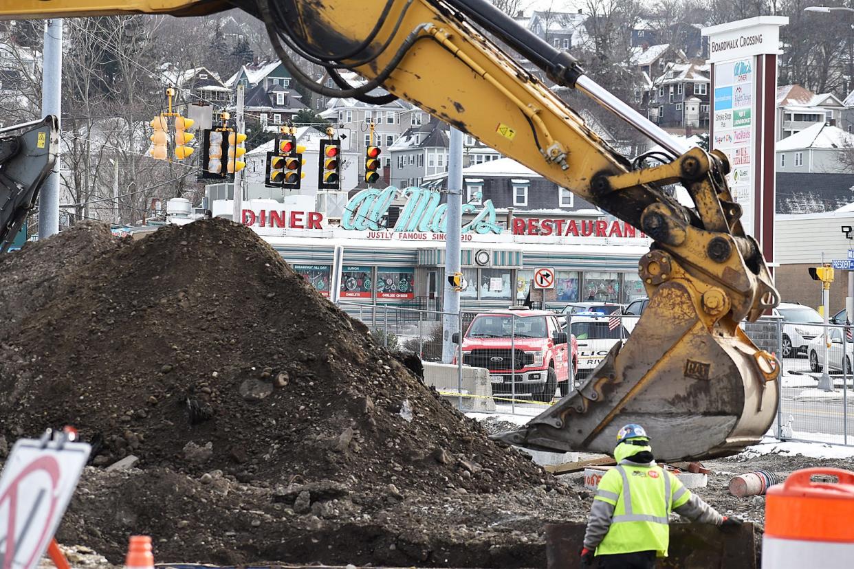 A construction vehicle excavates part of Davol Street near President Avenue and Al Mac's Diner, as part of the Route 79 construction project in Fall River on Thursday, Jan. 18, 2023.