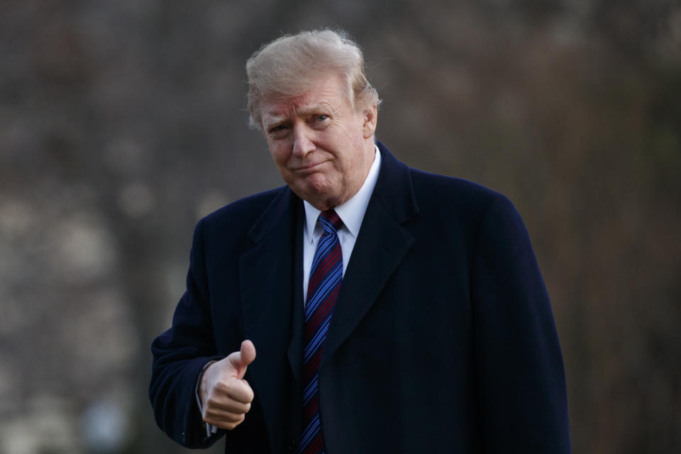 President Donald Trump gives a thumbs-up after arriving on Marine One on the South Lawn of the White House in Washington, Friday, Feb. 8, 2019. The President was returning to the White House after his annual physical exam at Walter Reed National Military Medical Center. (AP Photo/Carolyn Kaster)