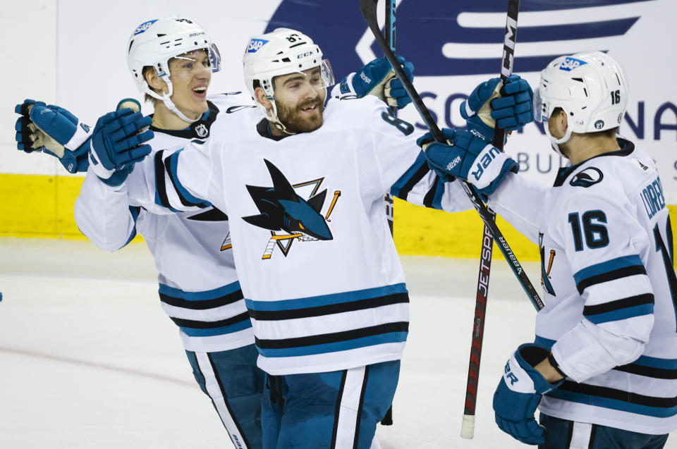 San Jose Sharks forward Martin Kaut, center, celebrates his goal with teammates during the second period of an NHL hockey game against the Calgary Flames in Calgary, Alberta, Saturday, March 25, 2023.(Jeff McIntosh/The Canadian Press via AP)