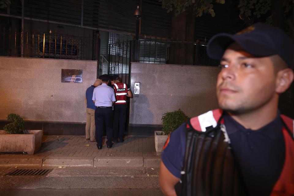 Police members stand guard outside the Iranian Embassy in Tirana, Albania, Wednesday, Sept. 7, 2022. Albania cut diplomatic ties with Iran and expelled the country's embassy staff over a major cyberattack nearly two months ago that was allegedly carried out by Tehran on Albanian government websites, the prime minister said Wednesday. (AP Photo/Franc Zhurda)