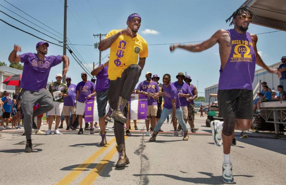 Members of the Omega Psi Phi fraternity perfvormed a step routine in front of the judges stand at the JuneteenthKC 2021 Cultural Parade Saturday, June 12, 2021 in the Historic Jazz District near 18th and Vine.