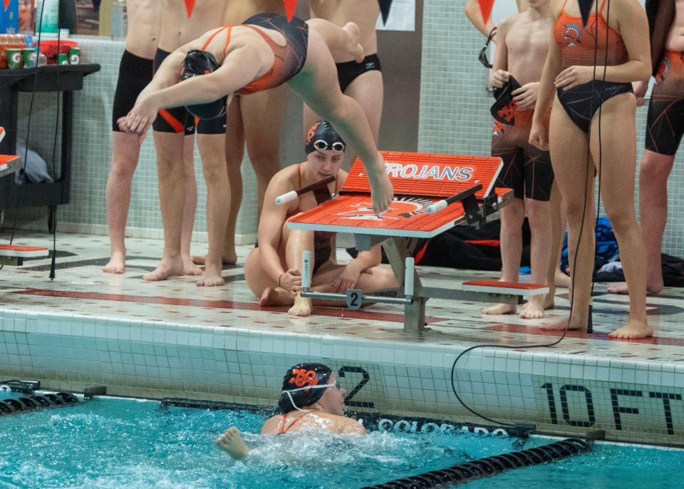 York Suburban's Gabby Philippe starts her leg of the 200 free relay after Chloe Chevaux touched the pool in a meet against Central York on Thursday, Dec. 21, 2023.