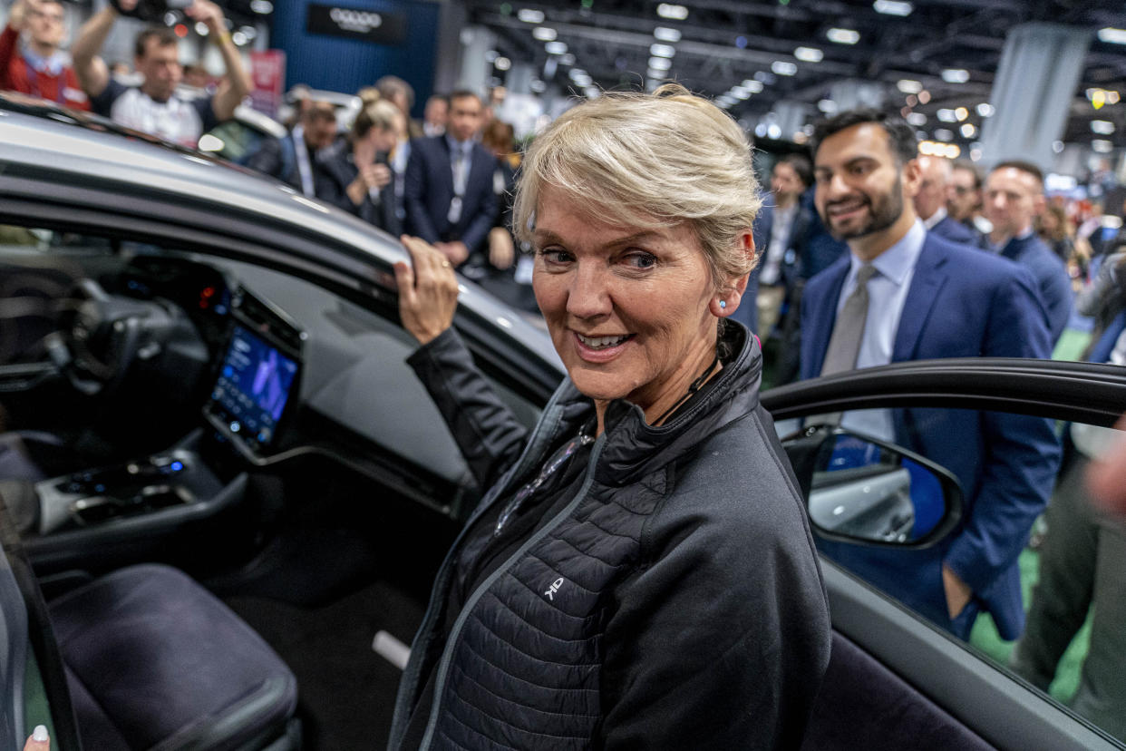 Energy Secretary Jennifer Granholm, center, and and White House national climate adviser Ali Zaidi, right, look at electric vehicles during a visit to the Washington Auto Show in Washington, Wednesday, Jan. 25, 2023. (AP Photo/Andrew Harnik)