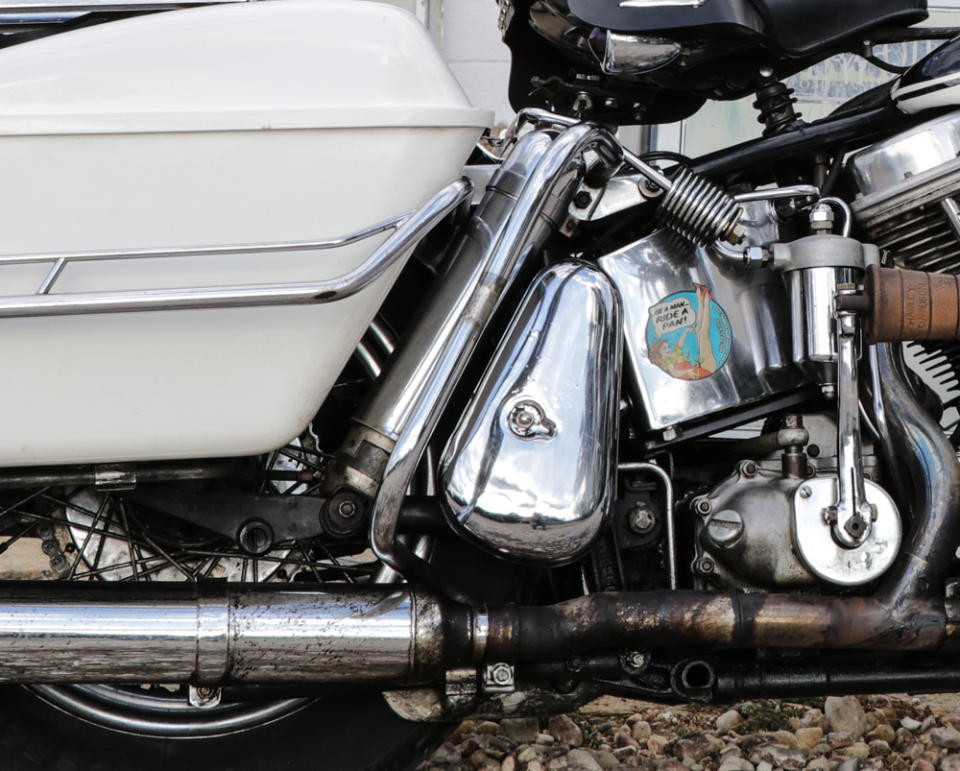 Tucked between the rear saddlebag and the tool box, the chrome rear shock is easy to miss.