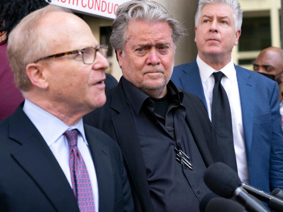 Former White House strategist Steve Bannon accompanied by his attorneys David Schoen, left and M. Evan Corcoran speaks with the media as he departs the federal court after a jury found him guilty on both counts in his contempt-of-Congress trial in Washington, Friday, July 22, 2022.