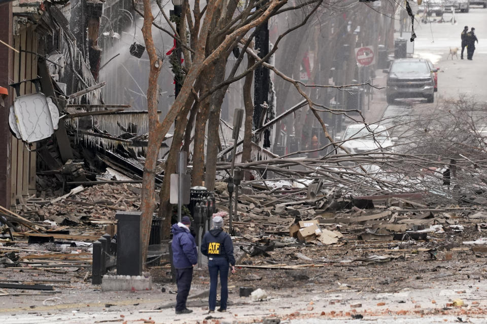 Emergency personnel work near the scene of an explosion in downtown Nashville on Christmas Day. Source: AP