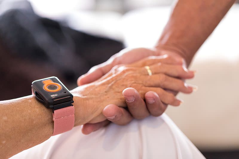 A photo illustration provided by CarePredict shows an individual wearing the company's Tempo wearable wristband