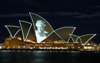 <p>An image of Britain's Queen Elizabeth is illuminated on the sail of Sydney Opera House, following the Queen's passing, in Sydney, Australia, September 9, 2022. REUTERS/Jaimi Joy - RC2QDW9E4384</p> 