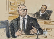 FILE - This artist sketch depicts the trial of Oath Keepers leader Stewart Rhodes, left, as he testifies before U.S. District Judge Amit Mehta on charges of seditious conspiracy in the Jan. 6, 2021, attack on the U.S. Capitol, in Washington, Nov. 7, 2022. Jury deliberations are expected to begin soon. (Dana Verkouteren via A, File)