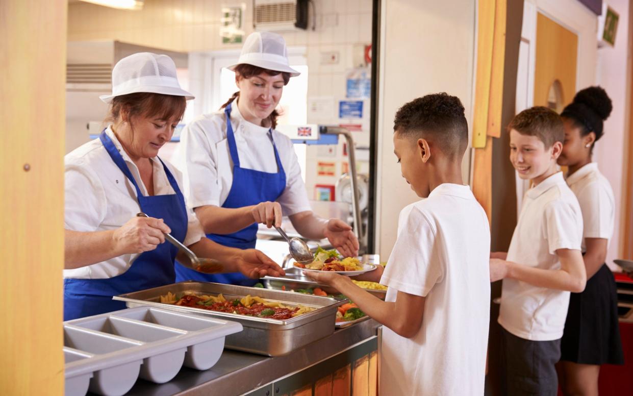 File image of children being served food in a school