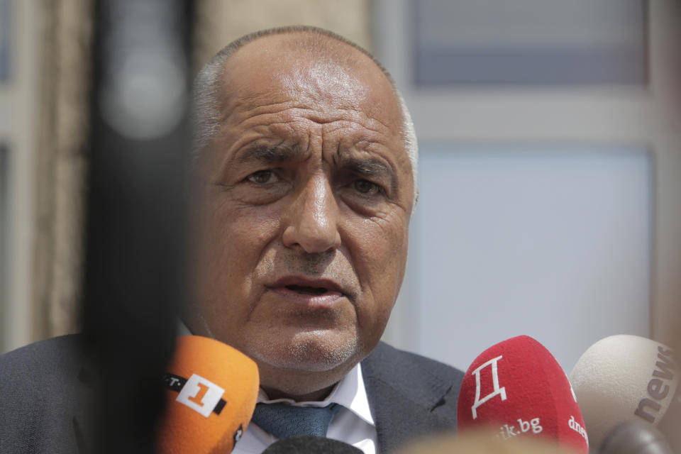 Bulgarian former Prime Minister Boyko Borissov talks to media after casting his vote at a polling station in Bankya, Sunday, June 9, 2024. Voters in Bulgaria are going to the polls on Sunday in national and European Parliament elections that have been overshadowed by political instability, economic inequality and growing concern over the war in nearby Ukraine. (AP Photo/Valentina Petrova)