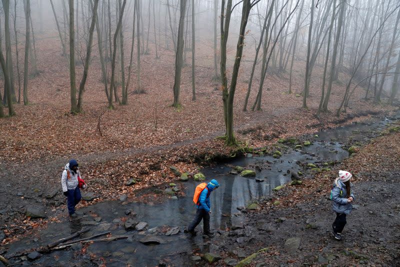 Kovacs hikes with her children Marton, 10, and Boglarka, 8, on National Blue Trail along the Pilis Mountains near Pilisszentlaszlo