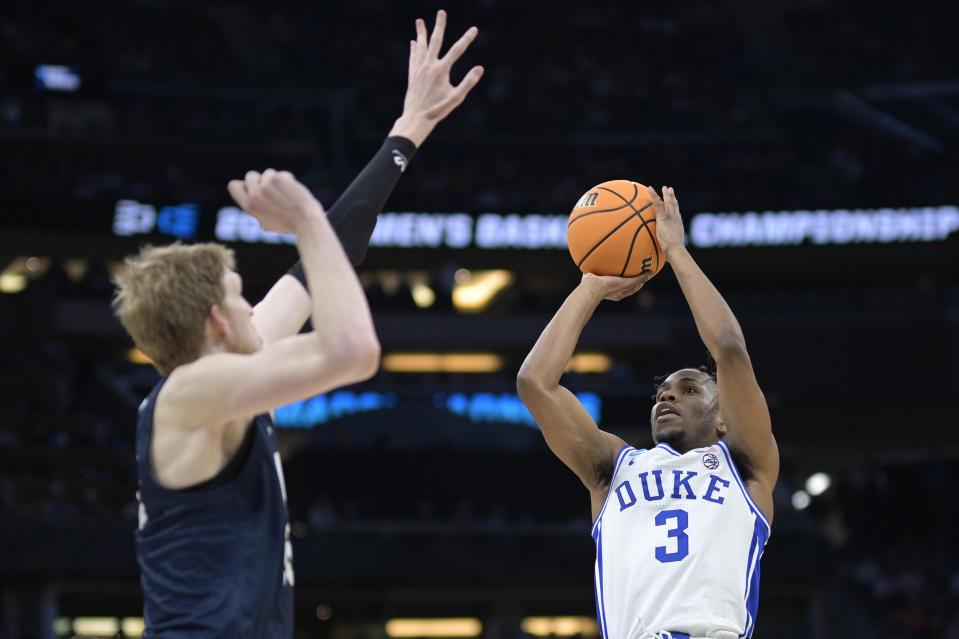 Duke guard Jeremy Roach (3) shoots as Oral Roberts forward Connor Vanover, left, defends during the second half of a first-round college basketball game in the NCAA Tournament, Thursday, March 16, 2023, in Orlando, Fla. (AP Photo/Phelan M. Ebenhack)