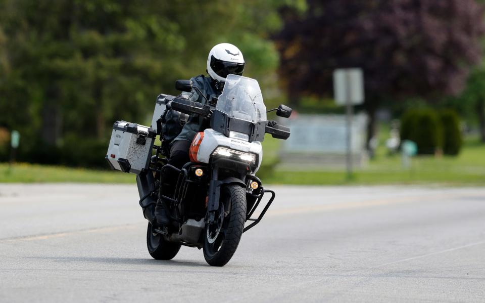 Ripon resident Whit Meza turns into the Kwik Trip lot in Sturgeon Bay on May 17, 2023, completing her goal to visit every store in the state on an 11-day motorcycle trip.