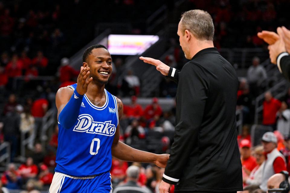 Mar 5, 2023; St. Louis, MO, USA; Drake Bulldogs guard D.J. Wilkins (0) celebrates with head coach Darian DeVries during the second half against the Bradley Braves in the finals of the Missouri Valley Conference Tournament at Enterprise Center. Mandatory Credit: Jeff Curry-USA TODAY Sports