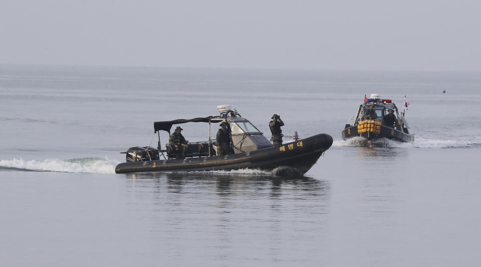 South Korean marine boats patrol near Yeonpyeong island, South Korea, Tuesday, Sept. 29, 2020. South Korea said Tuesday that a government official slain by North Korean sailors wanted to defect, concluding that the man, who had gambling debts, swam against unfavorable currents with the help of a life jacket and a floatation device and conveyed his intention of resettling in North Korea. (Kim Do-hoon/Yonhap via AP)