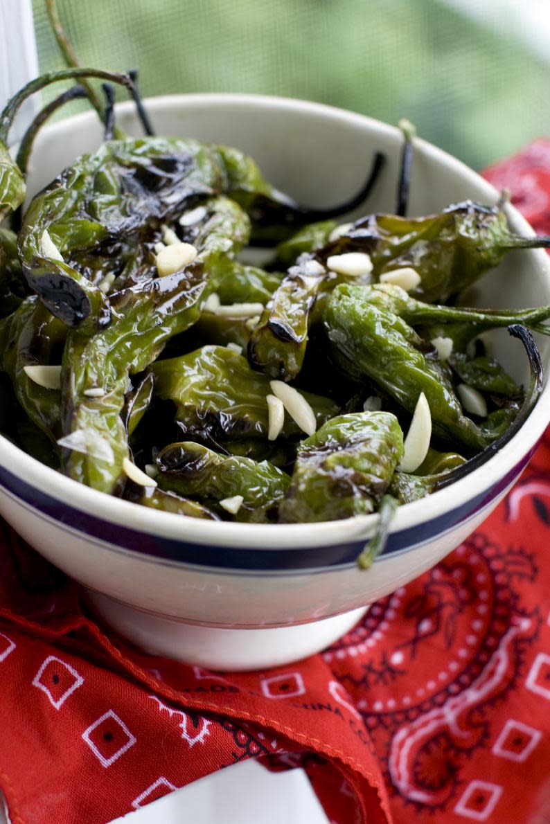 This June 10, 2013 photo taken in Concord, N.H. shows a recipe for grilled shishito peppers. (AP Photo/Matthew Mead)