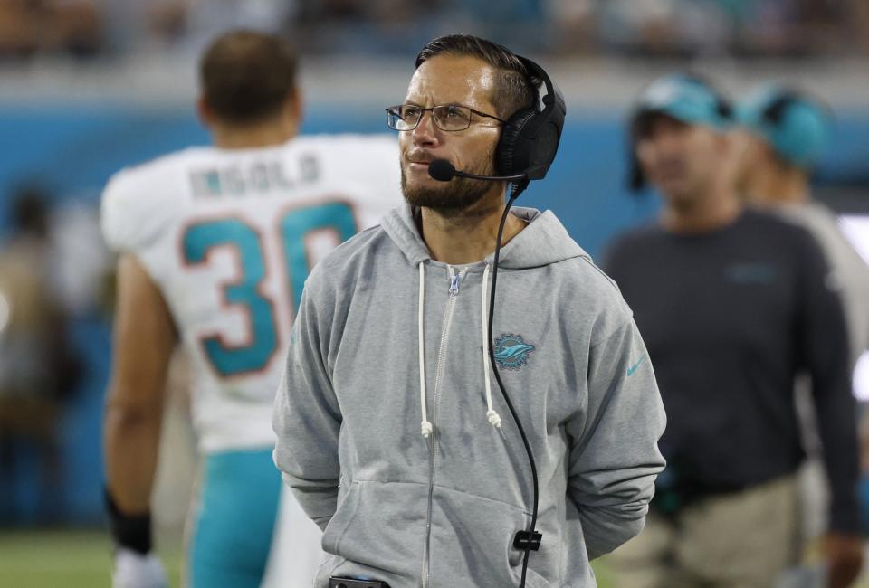 Miami Dolphins coach Mike McDaniel watches during the second quarter of the team's NFL preseason football game against the Jacksonville Jaguars on Saturday, Aug. 26, 2023, in Jacksonville, Fla. (Al Diaz/Miami Herald via AP)