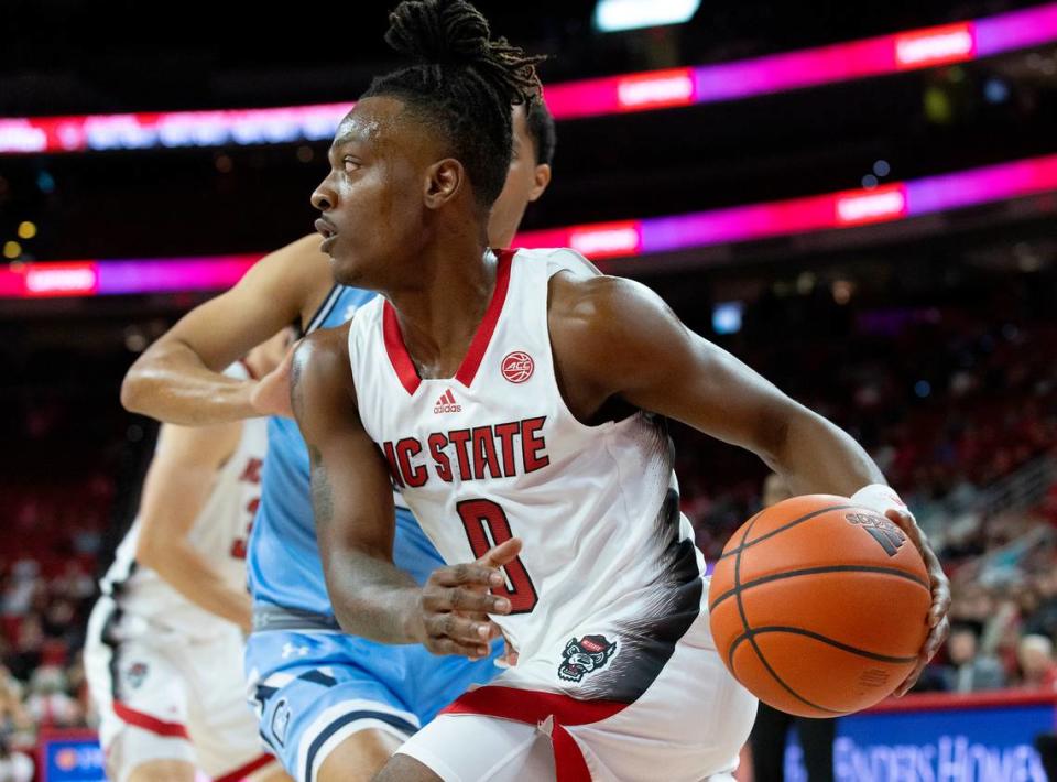 N.C. State’s DJ Horne drives past The Citadel’s Keynan Davis during the first half of the Wolfpack’s 72-59 win on Monday, Nov. 6, 2023, at PNC Arena in Raleigh, N.C.