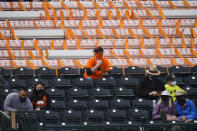 Fans are socially distanced as they watch a spring baseball game between the San Francisco Giants and the Los Angeles Angels in Scottsdale, Ariz., Sunday, Feb. 28, 2021. (AP Photo/Jae C. Hong)