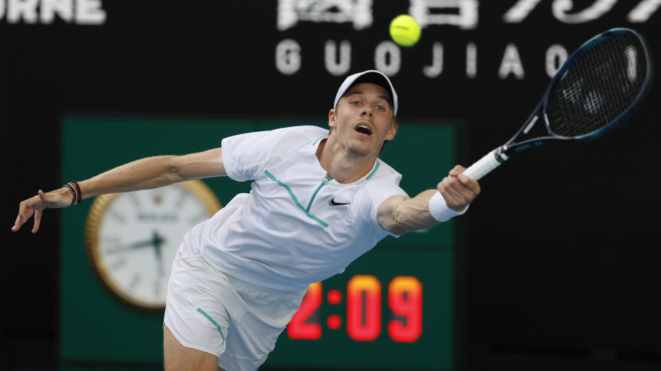 Denis Shapovalov of Canada makes a forehand return to Alexander Zverev of Germany during their fourth round match at the Australian Open tennis championships in Melbourne, Australia, Sunday, Jan. 23, 2022. (AP Photo/Tertius Pickard)