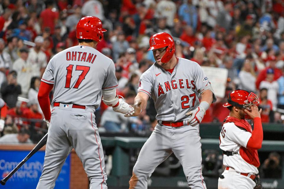Shohei Ohtani and Mike Trout celebrate a home run against the Cardinals.