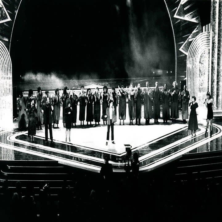 MJ with a choir behind him onstage