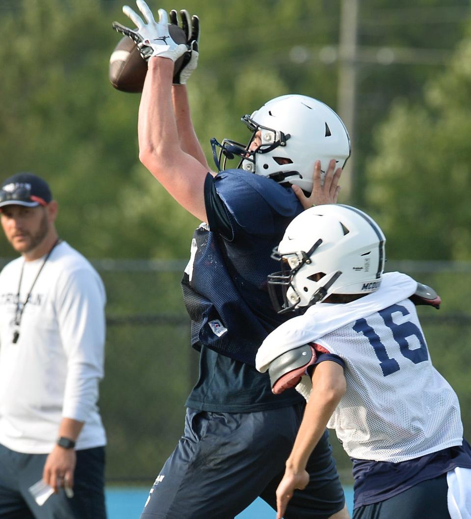McDowell junior Jake Hower makes a nice catch during practice at Gus Anderson Field in Millcreek Township on Aug. 8.