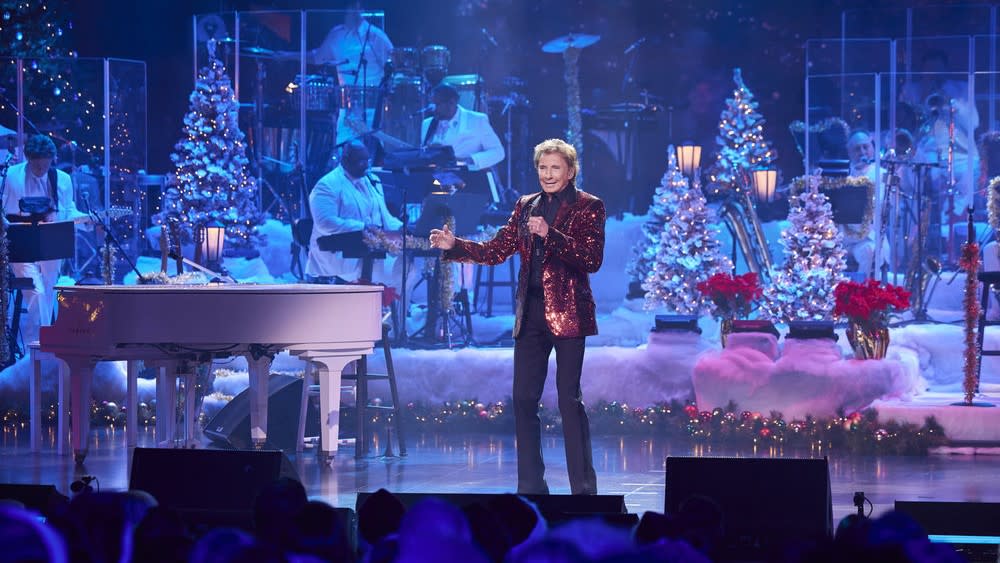  Barry Manilow performs on a holiday stage in Barry Manilow's A Very Barry Christmas. 