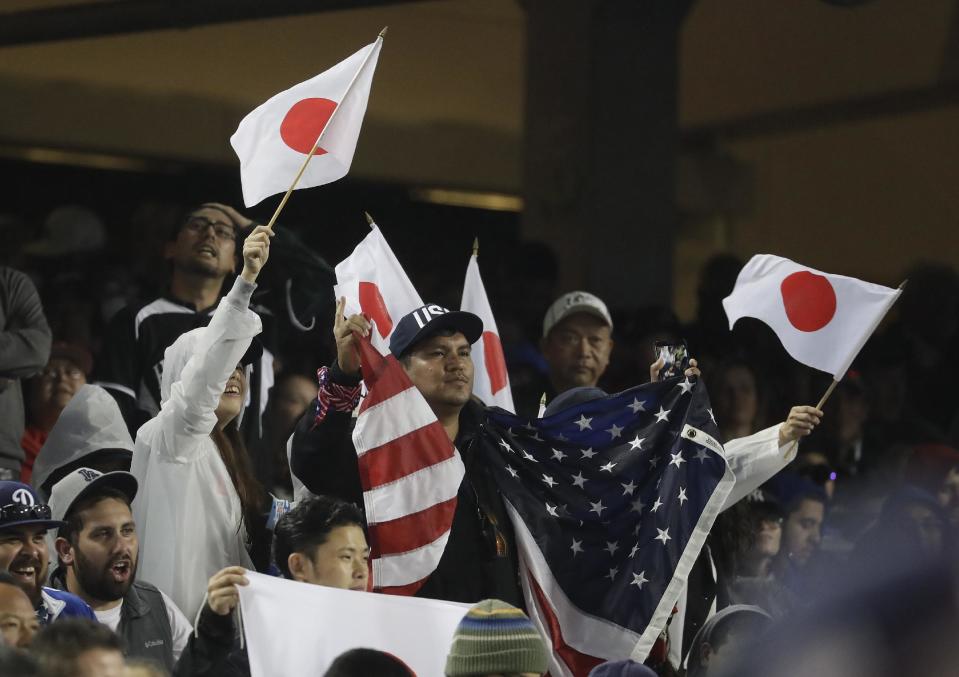 Fans cheer during the eighth inning of a semifinal in the World Baseball Classic between the United States and Japan, in Los Angeles, Tuesday, March 21, 2017. (AP Photo/Chris Carlson)