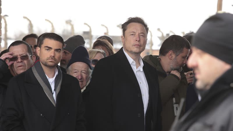 Tesla and SpaceX’s CEO Elon Musk, center, walks during his visit to the site of the Auschwitz-Birkenau Nazi German death camp in Oswiecim, Poland, on Monday, Jan. 22, 2024. The private visit was apparently in response to calls from some Jewish religious leaders for Musk to see with his own eyes the most symbolic site of the horrors of the Holocaust.
