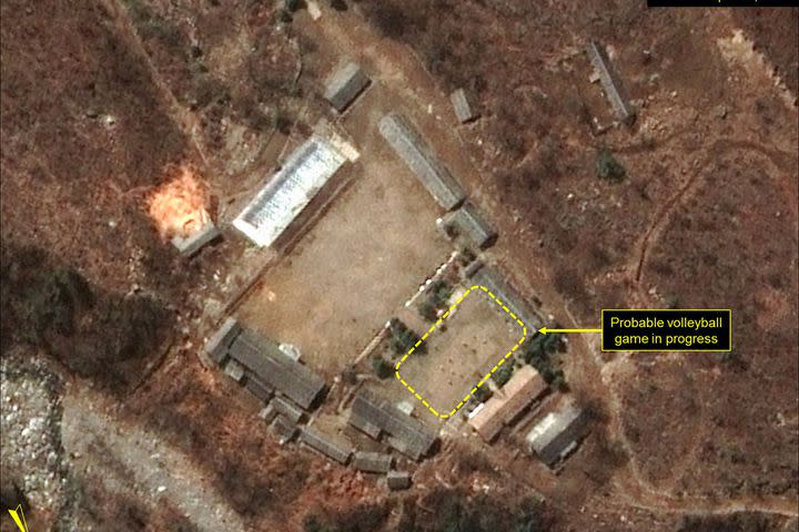 <p>North Korea's military has been spotted seemingly playing a game of volleyball at the main Punggye-ri nuclear test site.</p> <p>Satellite images of the site appear to show two six-player teams facing each other, with a net between them.</p> <p>Joseph Bermudez, an analyst for non-profit <a rel="nofollow noopener" href="http://38north.org/2017/04/punggye041917/" target="_blank" data-ylk="slk:38 North;elm:context_link;itc:0;sec:content-canvas" class="link ">38 North</a>, which first noticed the pictures, said multiple games were going on at the facility — at the administrative area, the support area, the command centre, and at the guard barracks.</p>  <p>A possible volleyball net seen in the command center area</p><div><p>Image: DigitalGlobe/Getty Images</p></div> <p>A probable volleyball game seen at the guard barracks at Punggye-ri</p><div><p>Image: DigitalGlobe/Getty Images</p></div><p>The people appear to be standing in formations consistent with volleyball games, he added.</p> <p>But if you thought the North Koreans were taking a break, it's more likely that the games were staged knowing the outside world is looking.</p>  <p>PUNGGYE-RI NUCLEAR TEST SITE, NORTH KOREA - APRIL 16, 2017. Figure 4. Probable volleyball game seen at the command center support area. (Photo DigitalGlobe/38 North via Getty Images)</p><div><p>Image: DigitalGlobe/Getty Images</p></div><p>Analysts <a rel="nofollow noopener" href="https://www.nytimes.com/2017/04/19/world/asia/north-korea-nuclear-test-volleyball.html" target="_blank" data-ylk="slk:told the New York Times;elm:context_link;itc:0;sec:content-canvas" class="link ">told the <em>New York Times</em></a> that the games were probably intended to send a message, as North Korea knows that the Punggye-ri test site is under intense scrutiny.</p> <p>The games could be North Korea's way of indicating that it's pausing its controversial nuclear missile testing activity — or that it's making it seem like it has.</p> <p>Both <a rel="nofollow noopener" href="http://www.fmprc.gov.cn/mfa_eng/xwfw_665399/s2510_665401/2511_665403/t1454907.shtml" target="_blank" data-ylk="slk:China;elm:context_link;itc:0;sec:content-canvas" class="link ">China</a> and <a rel="nofollow noopener" href="https://www.washingtonpost.com/world/asia_pacific/pence-makes-surprise-stop-to-demilitarized-zone-during-korea-trip/2017/04/16/e1da822e-230e-11e7-a1b3-faff0034e2de_story.html?tid=ptv_rellink&utm_term=.fb6a67e47a51" target="_blank" data-ylk="slk:the U.S.;elm:context_link;itc:0;sec:content-canvas" class="link ">the U.S.</a> have raised condemnation of the hermit country's nuclear tests in recent weeks, as Trump places pressure on the North to halt its missile activity.</p> <p>"While strongly suggestive of the completion of preparations for a sixth nuclear test, the imagery alone does not provide any definitive evidence of the installation of a nuclear device or indication of the specific timing for such an event," Bermudez told <em>Mashable</em>.</p> <p>Volleyball games are a normal occurrence at Punggye-ri, according to Melissa Hanham, an analyst at the Middlebury Institute of International Studies in Monterey, California. The game is a popular sport in North Korea. </p> <p>"It doesn't mean anything other than people are there and [that] they are bored," Hanham said in an email to <em>Mashable. </em></p> <p>Both Hanham and Bermudez agreed that the site could still be ready for a nuclear test. </p> <p>38 North described the site as "primed and ready" <a rel="nofollow noopener" href="http://38north.org/2017/04/punggyeri041217/" target="_blank" data-ylk="slk:on April 12;elm:context_link;itc:0;sec:content-canvas" class="link ">on April 12</a>, and a UN representative of the reclusive dictatorship confirmed that a new nuclear test was <a rel="nofollow noopener" href="http://www.channelnewsasia.com/news/asiapacific/north-korea-says-ready-to-react-to-any-mode-of-war-from-us/3685330.html" target="_blank" data-ylk="slk:under preparation;elm:context_link;itc:0;sec:content-canvas" class="link ">under preparation</a>. </p> <p><a rel="nofollow noopener" href="http://www.channelnewsasia.com/news/asiapacific/tensions-high-north-korea-readies-nuclear-test-report/3674450.html" target="_blank" data-ylk="slk:Analysts speculated;elm:context_link;itc:0;sec:content-canvas" class="link ">Analysts speculated</a> that the reclusive dictatorship could trigger a nuclear test to mark the 105th birth anniversary of the country's founding leader, Kim Il-Sung, which occurred last Saturday. Kim Il-Sung's grandson, Kim Jong-un, is North Korea's current leader.</p> <p>"The ultimate choice as to whether to test, or not to test, rests solely in the hands of Kim Jong-un," Bermudez said.</p> <div> <h2>WATCH: Scientists discovered a rare giant black worm monster in the Philippines</h2>  </div>