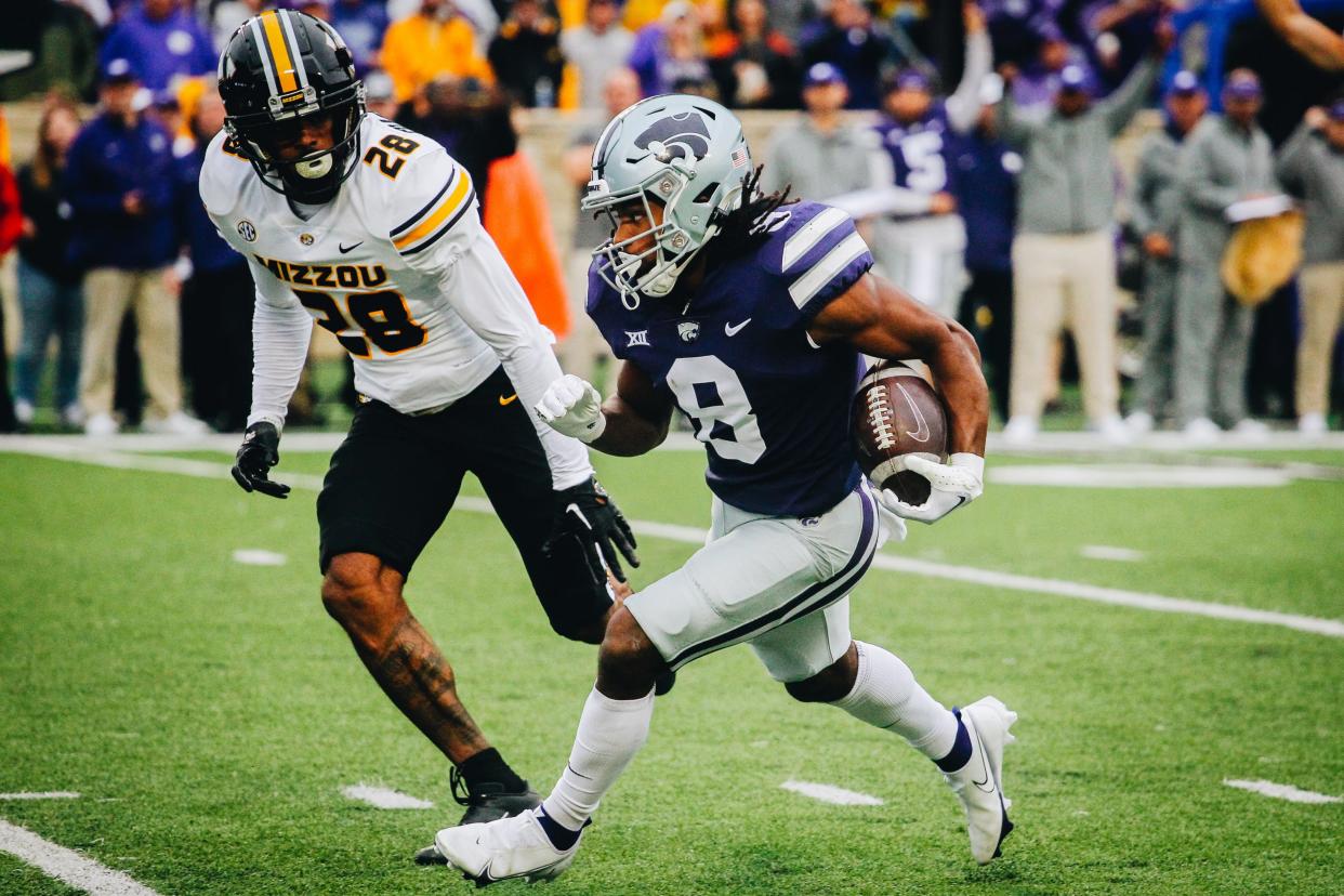 Kansas State's Phillip Brooks runs away from Missouri's Joseph Charleston (28) during Missouri's game against Kansas State at Bill Snyder Family Stadium in Manhattan, Kansas, on Sept. 10, 2022.