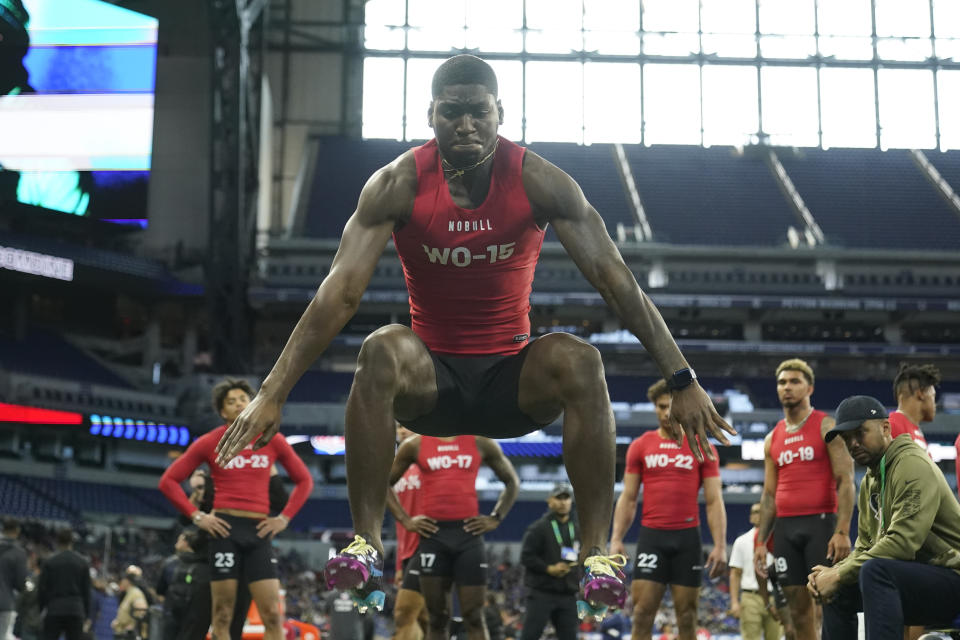 FILE - Charlotte wide receiver Grant Dubose runs a drill at the NFL football scouting combine in Indianapolis, Saturday, March 4, 2023. DuBose bet on himself even when nobody else dared. He accepted the only scholarship he was offered out of high school. He worked three jobs when the COVID-19 season canceled his season. He left Division II Miles College to try out with Division I Charlotte at the urging of a friend. Then after two good seasons with the 49ers, now he could see the payoff -- going from bagging groceries and working Wal-Mart shifts to a pro football career. (AP Photo/Michael Conroy, File)