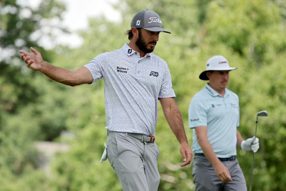 Max Homa and Joel Dahmen walk off the ninth tee during the first round of the Rocket Mortgage Classic at Detroit Golf Club on July 28, 2022 in Detroit, Michigan. (Photo by Gregory Shamus/Getty Images)