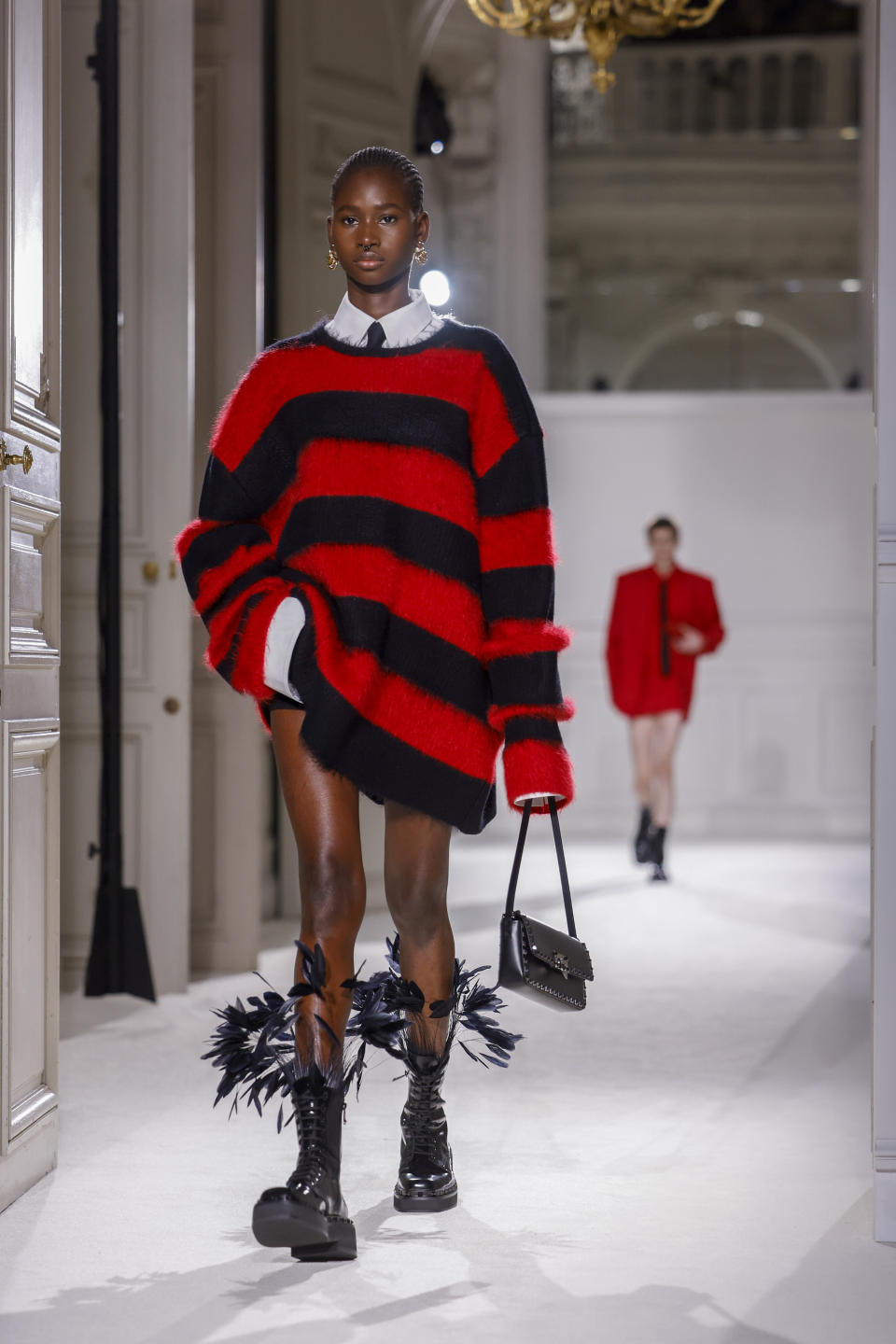 A model wears a creation as part of the Valentino Fall/Winter 2023-2024 ready-to-wear collection presented Sunday, March 5, 2023 in Paris. (Vianney Le Caer/Invision/AP)