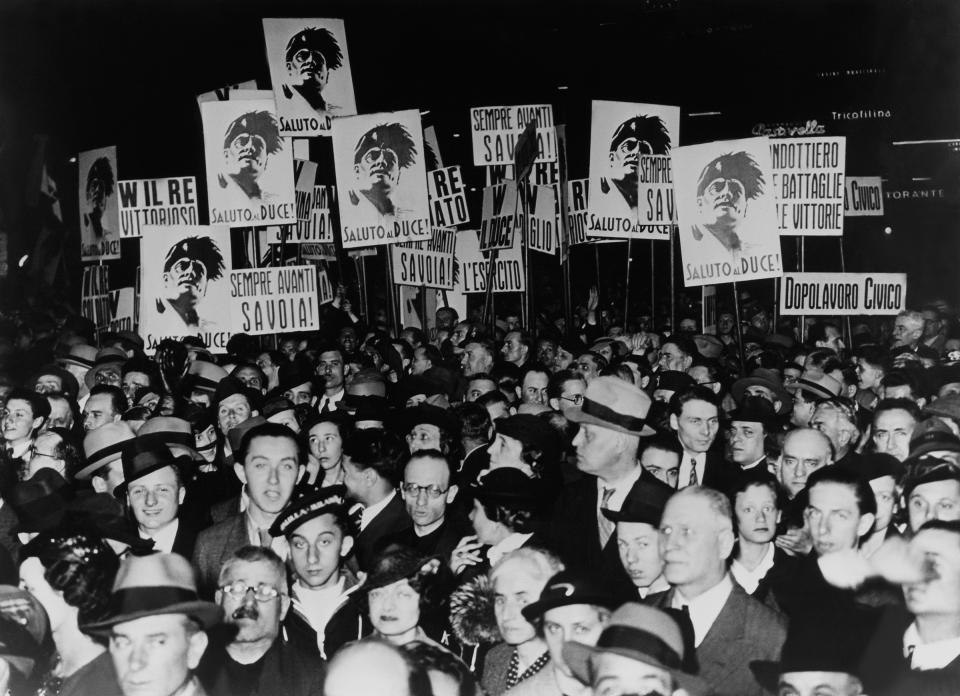 A crowd in Milan watches a broadcast of Mussolini announcing the creation of an Italian empire on March 12, 1936.<span class="copyright">Keystone-France/Getty Images</span>