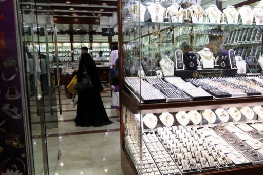 A woman shop at a store in a gold market in Dubai. A survey by the UAE Marriage Fund show that 87% of respondents blamed high dowries for low marriage rates among Emirati women