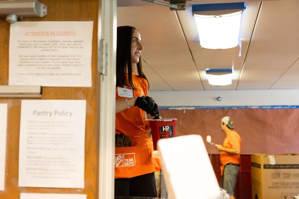 Morgan Saulnier paints at Freedom Landing in Salt Lake City on Wednesday, July 12, 2023. The Home Depot Foundation, in partnership with the Housing Authority of Salt Lake City, renovated two permanent housing facilities on Wednesday meant for homeless veterans, individuals with disabilities and the chronically homeless. | Megan Nielsen, Deseret News