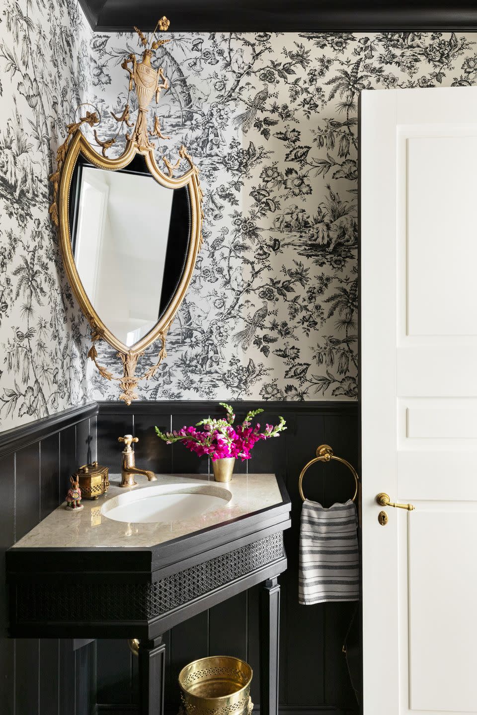 powder room designed by alexandra kaehler design black and white wallpaper by pierre frey and beadboard painted in black by benjamin moore