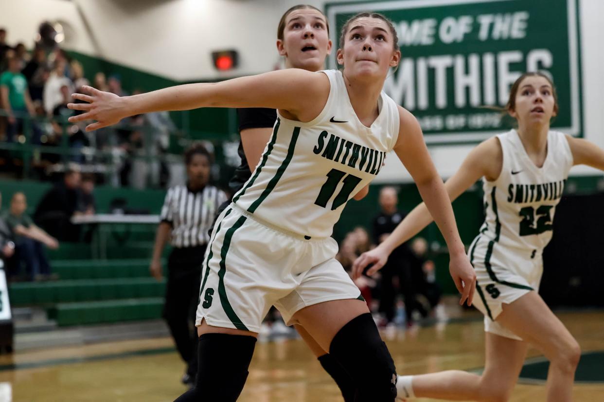 Smithville's Naomi Keib boxes out against Hiland during her senior year.