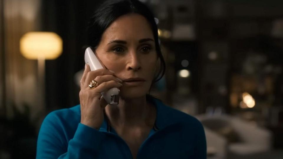 Courteney Cox talks to Ghostface on the phone in Scream VI.