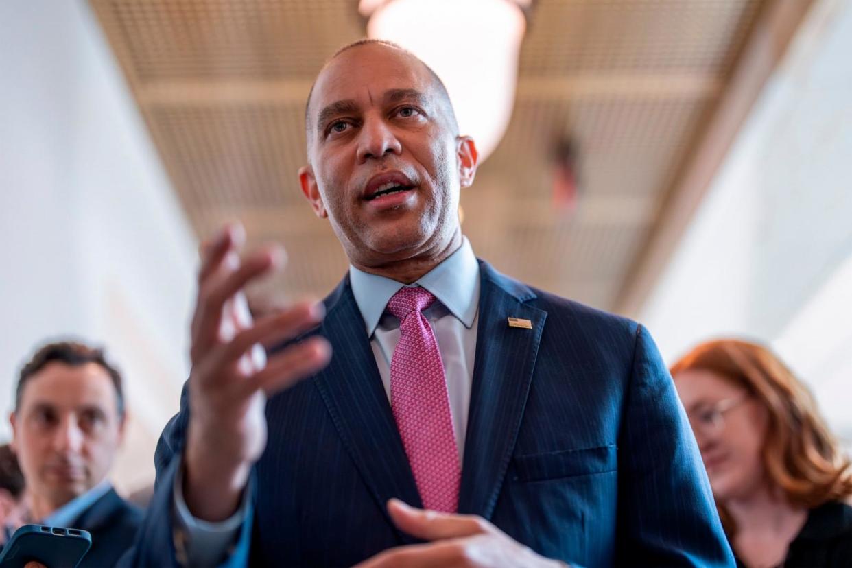 PHOTO: House Minority Leader Hakeem Jeffries, D-N.Y., walks with reporters at the Capitol, April 19, 2024, in Washington. (J. Scott Applewhite/AP)