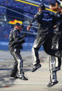 Aric Almirola's crew celebrates after he won the 1000Bulbs.com 500 NASCAR Cup Series auto race at Talladega Superspeedway, Sunday, Oct. 14, 2018, in Talladega, Ala. (AP Photo/Butch Dill)