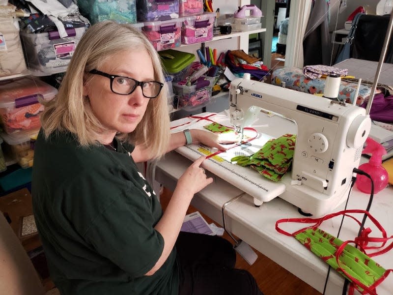 Elizabeth Townsend Gard, a law professor at Tulane University and co-founder of Millionmasksaday.com, works on one of the many masks she's created since the coronavirus pandemic started.