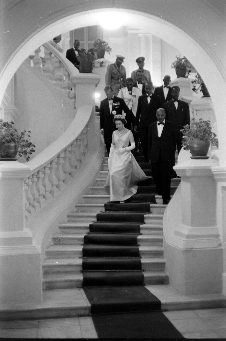 Queen Elizabeth II descending a staircase at a formal gathering during her visit to Ethiopia.<span class="copyright">John Loengard—The LIFE Picture Collection/Getty Images</span>